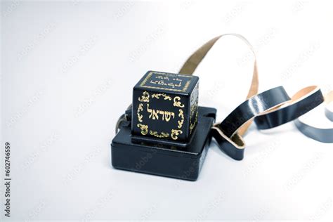 tefillin box are made of metal|jewish black box with strap.